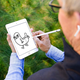 Illustration for article titled Photoshop Contest: What Is Tim Cook Really Drawing?